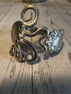 Silverware Fork Shaped Into A Swirl Design With Ornate Handle